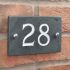 Slate house number 28 v-carved with white infill numbers