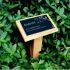 Wooden stake with anodised aluminium plaque